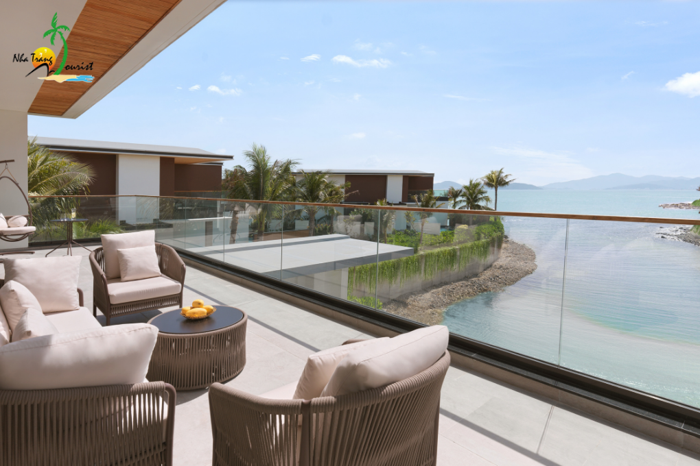 Lagoon Villa at Villa Le Corail, a Gran Meliá Hotel, featuring a spacious sea-view terrace and private outdoor seating