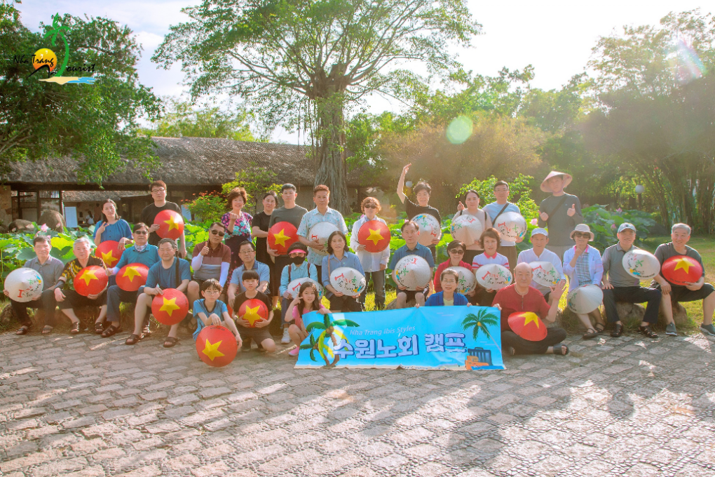A private group enjoying a shared travel experience with NhaTrangTourist in Vietnam
