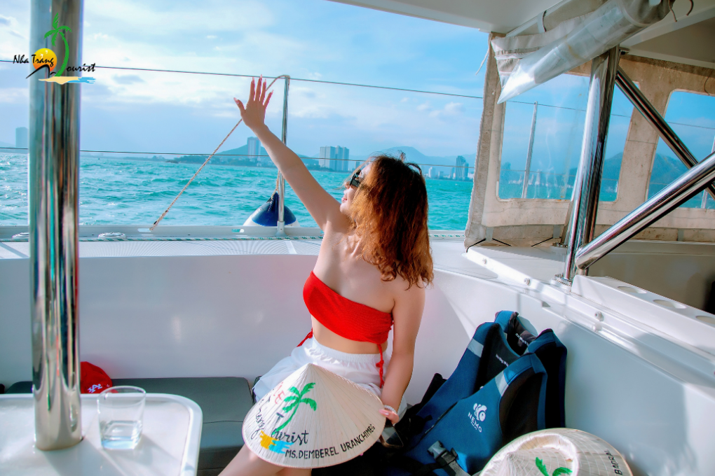A traveller enjoying a private boat experience while exploring the coastal waters of Nha Trang