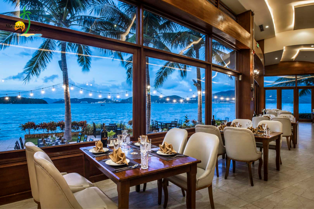 Restaurant seating at Hon Tam Resort Nha Trang overlooking the sea, adding a dining option to a premium island stay
