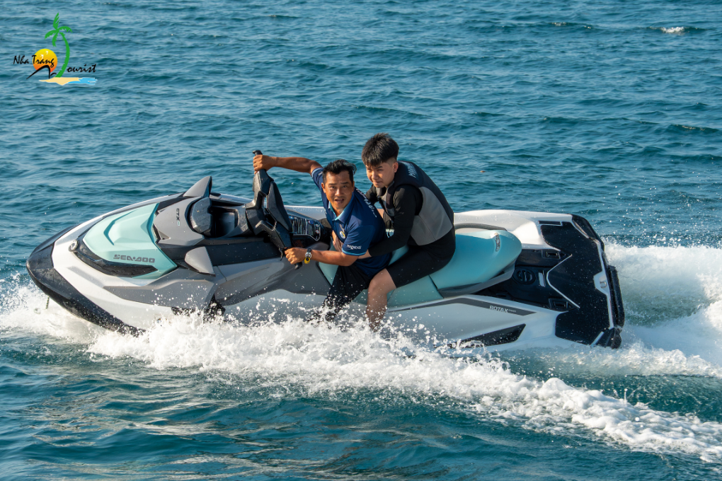 Riding a personal watercraft across the bay, adding an active water sport to their sea experience